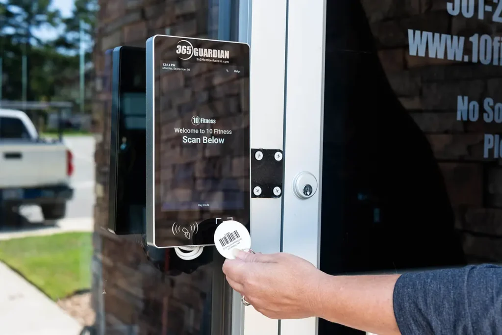 gym-goer using the 365 Guardian kiosk