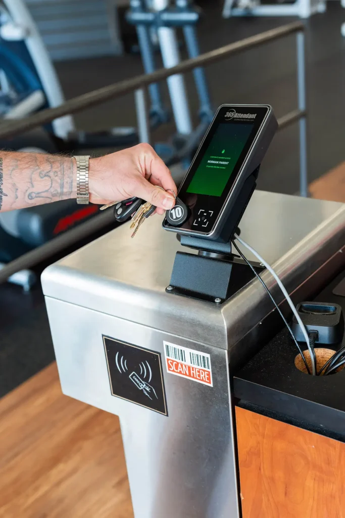 gym-goer using the 365 Attendant kiosk