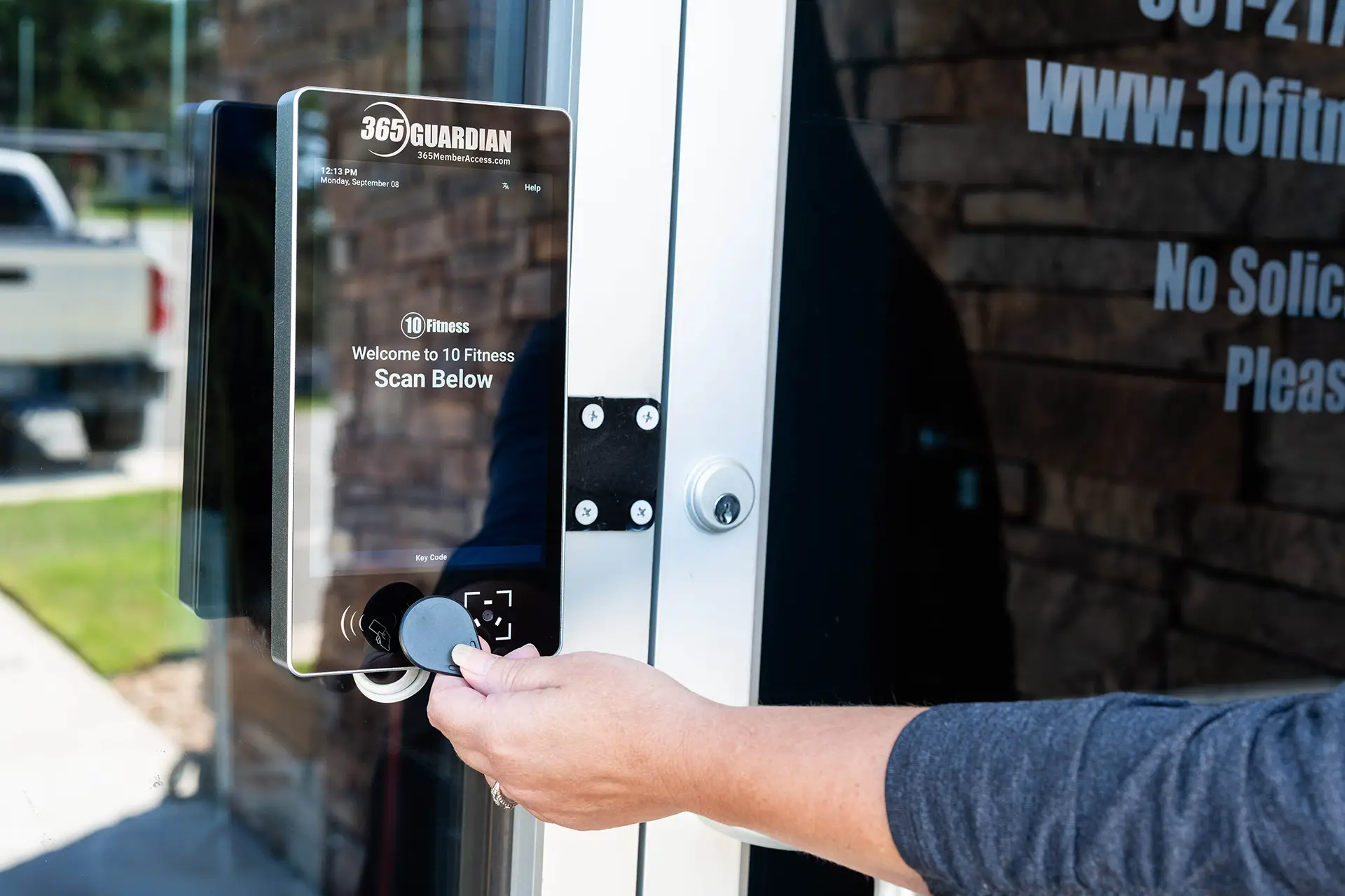 member scanning access fob at a 365 Guardian kiosk