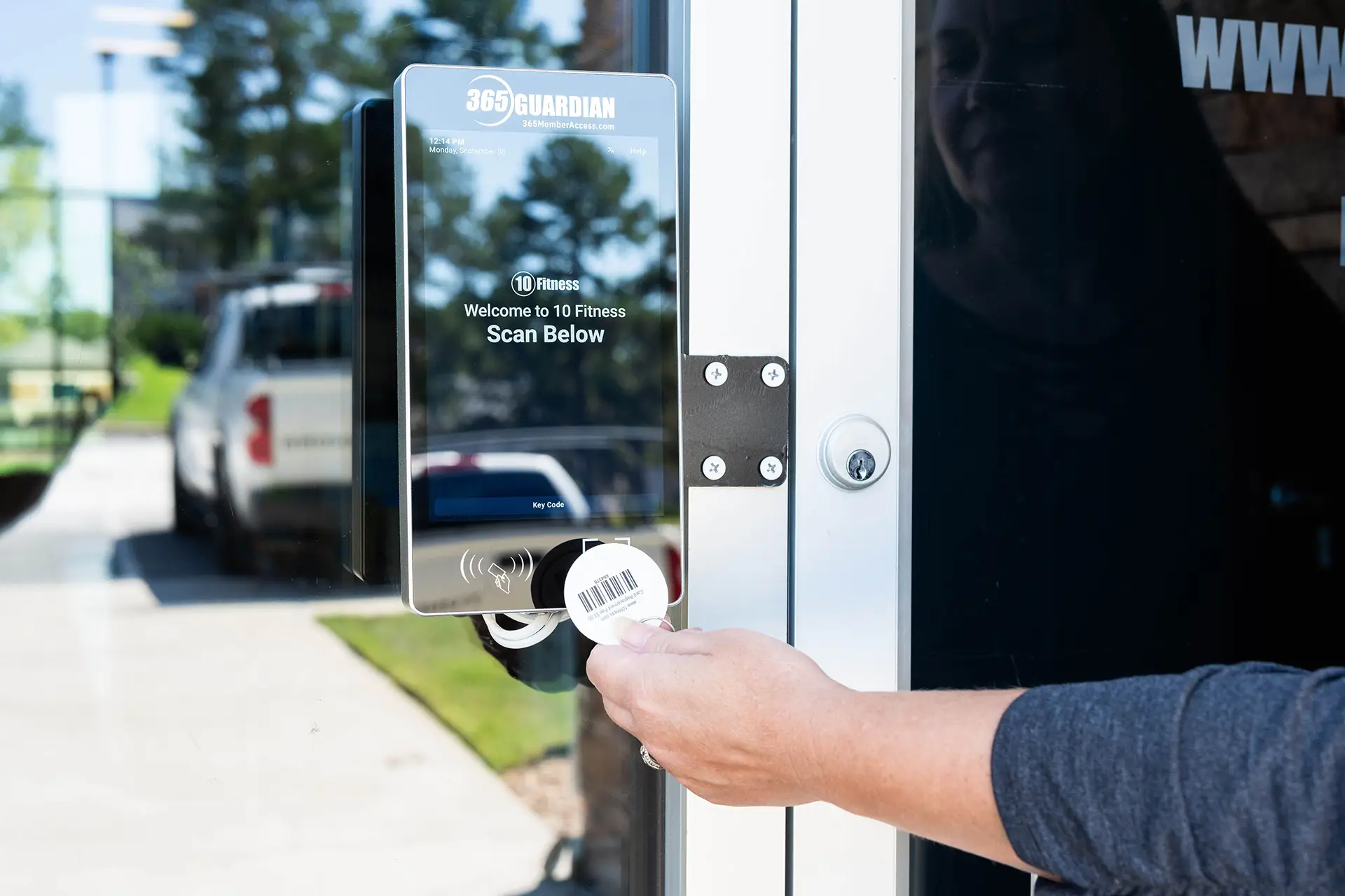 member scanning access fob at a 365 Guardian kiosk