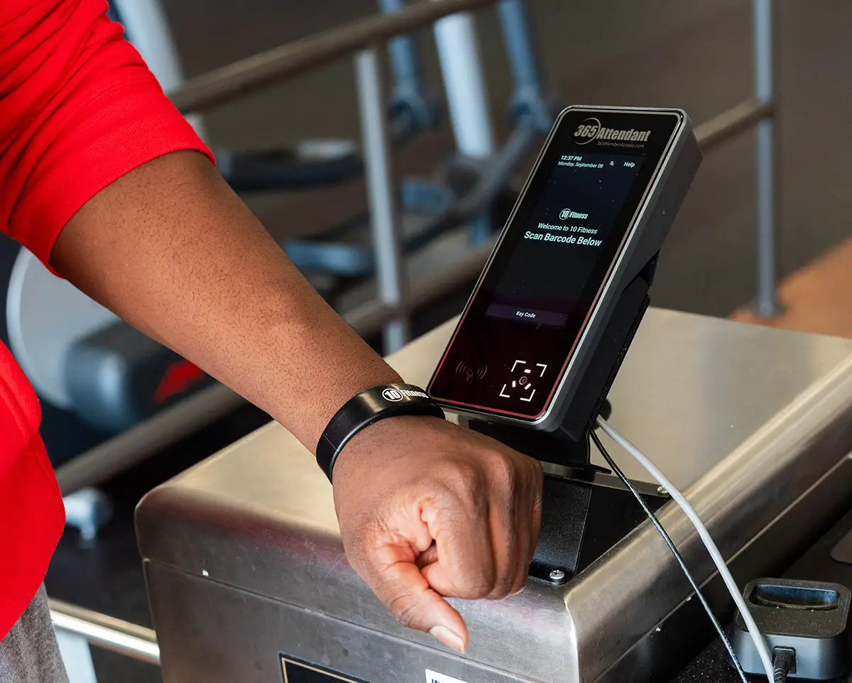 member scanning wristband at a 365 Attendant kiosk